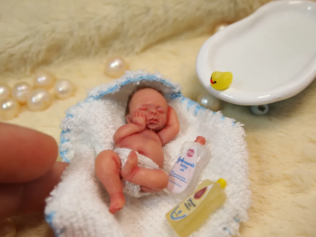 OOAK miniature baby doll bath time scene with tiny bathtub, towel, baby bottles, and rubber duck accessories - by Mini Baby Dolls