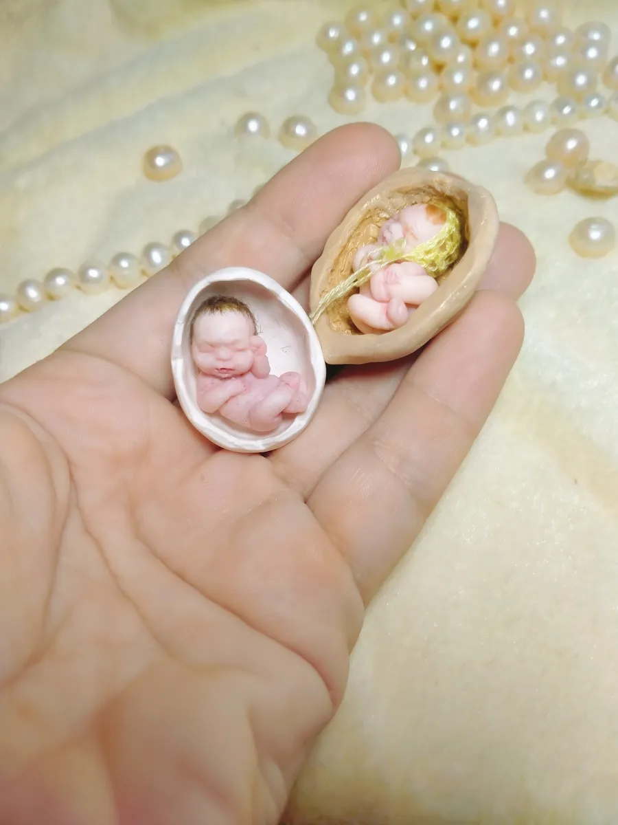 Two OOAK miniature baby dolls in creative displays - one sleeping in walnut shell, one in tiny bottle cap pendant - by Mini Baby Dolls