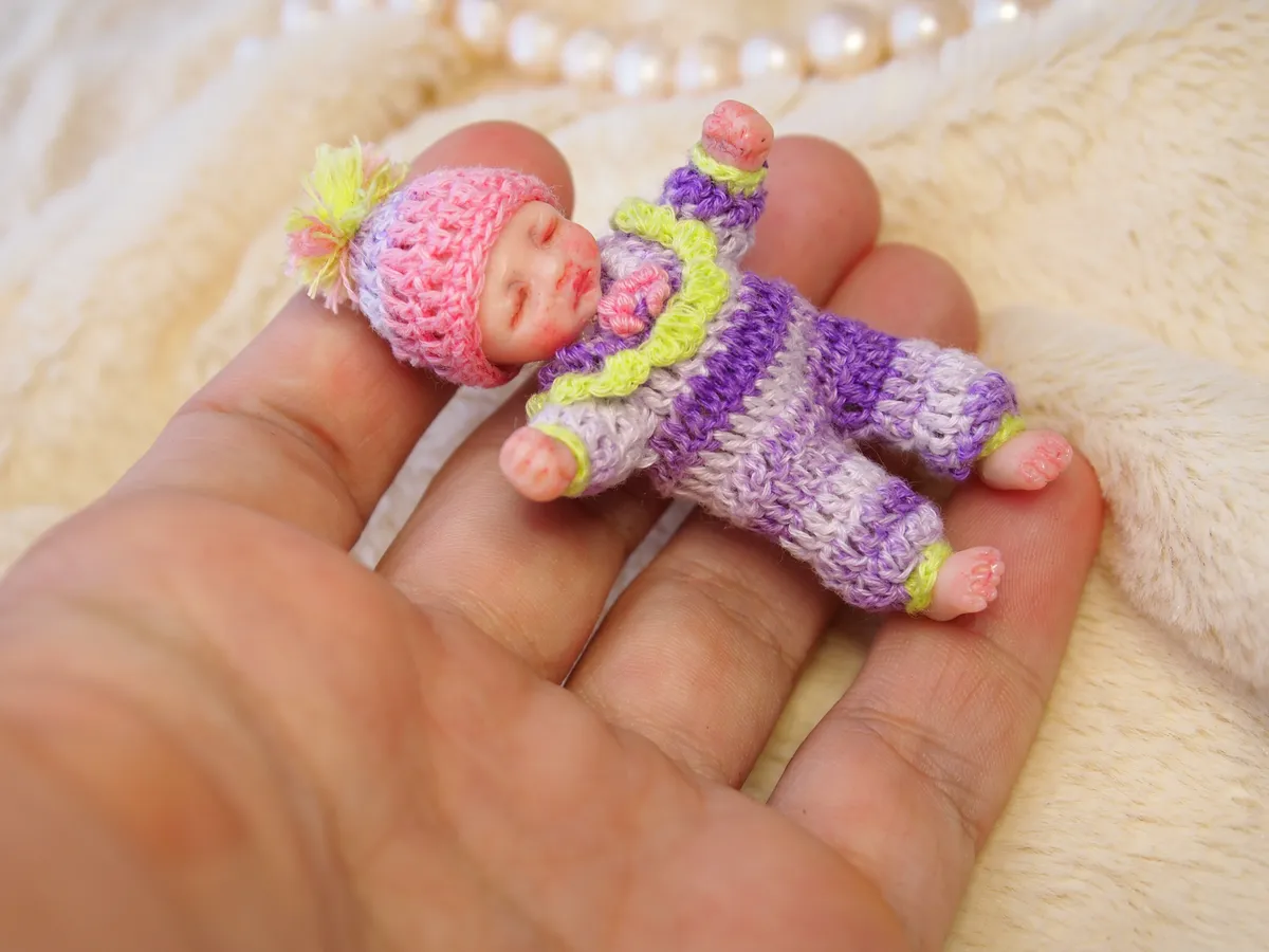 Sleeping OOAK miniature baby doll in colorful purple and pink striped clown/jester crocheted onesie with matching hat - by Mini Baby Dolls