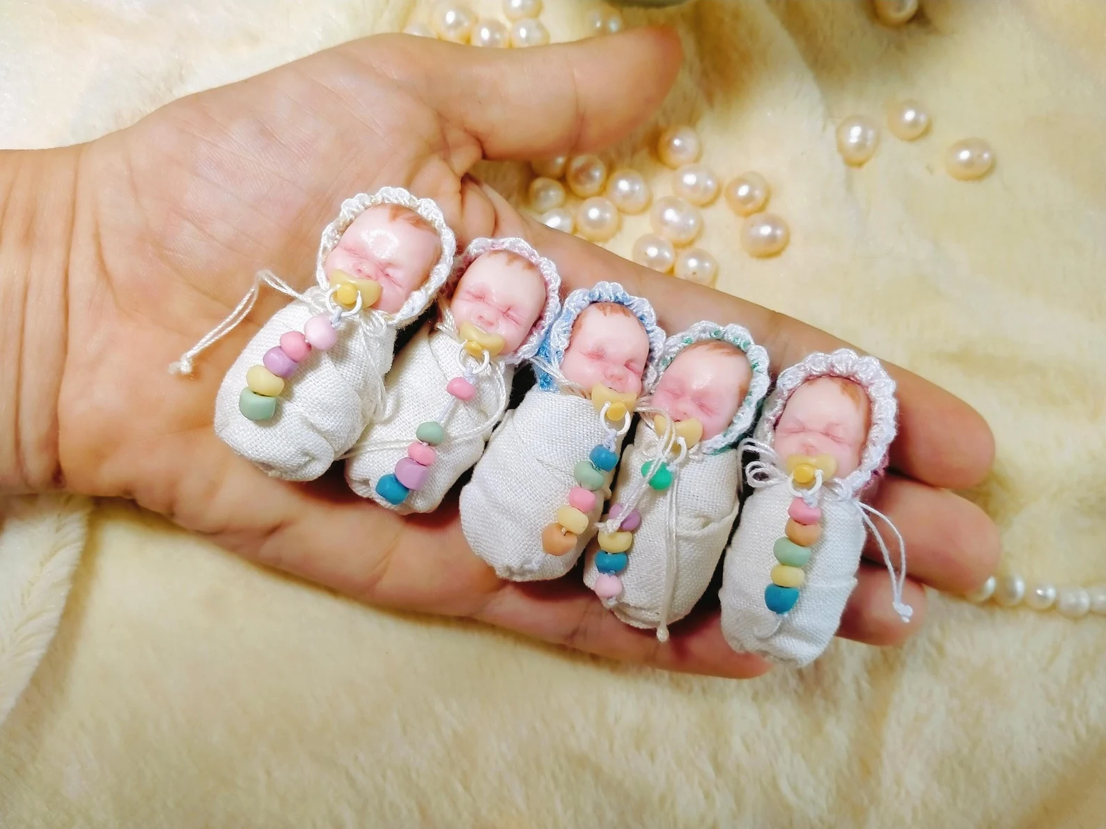 Swaddle Reborn Baby: Realistic 1:12 scale OOAK micro reborn baby (1.5 inch). Polymer clay with soft body, sewn-on swaddle blanket, and crochet hat.